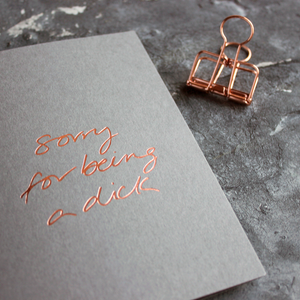 Sorry For Being A Dick grey luxury card is hand foiled in rose gold on the front
