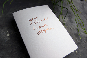 luxury white greetings card with rose gold foil written on the front - the card say You Should Have Eloped