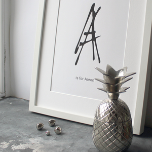 This personalised children's initial print is a unique hand drawn typography design in black on white paper.