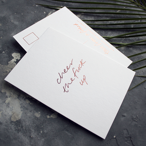 a hand pressed rose gold foil postcard that says Cheer The Fuck Up