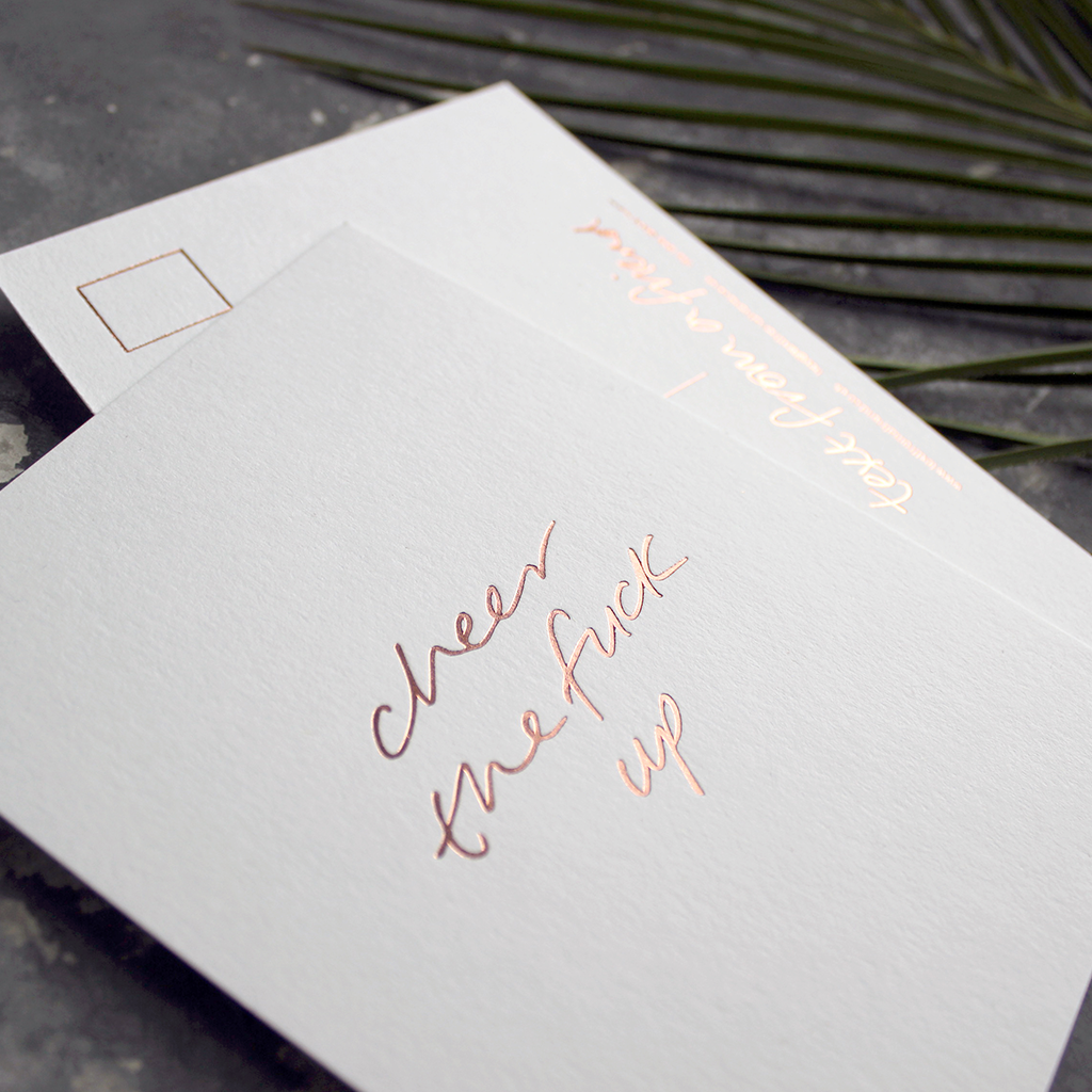 a hand pressed rose gold foil postcard that says Cheer The Fuck Up