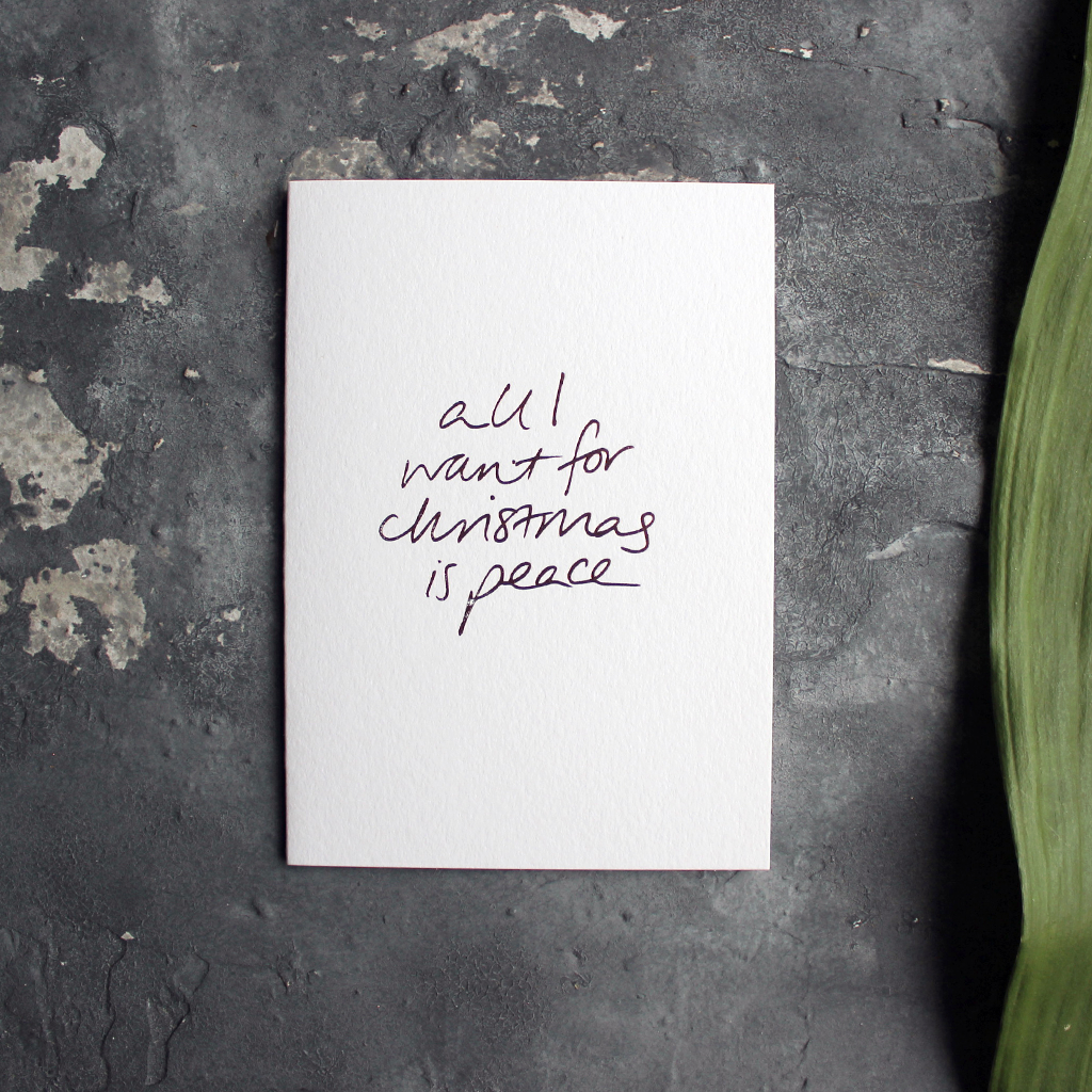Christmas Card with hand written foil block message saying all I want for christmas is peace