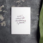 Christmas Card with hand written foil block message saying all I want for christmas is peace