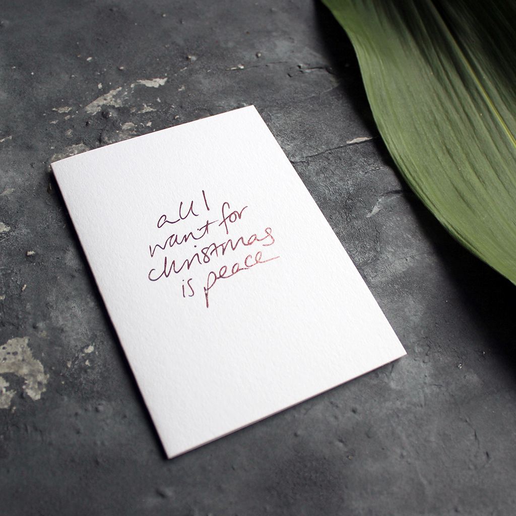 Christmas Card with hand written foil block message saying all I want for christmas is peace