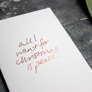 Christmas Card with hand written foil block message saying all I want for christmas is peace