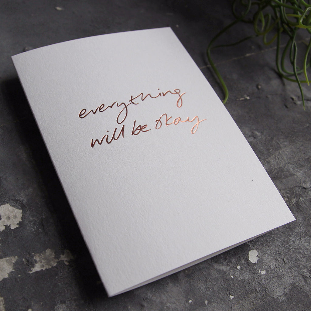 this hand foiled luxury white card says Everything Will Be Okay on the front in rose gold foil