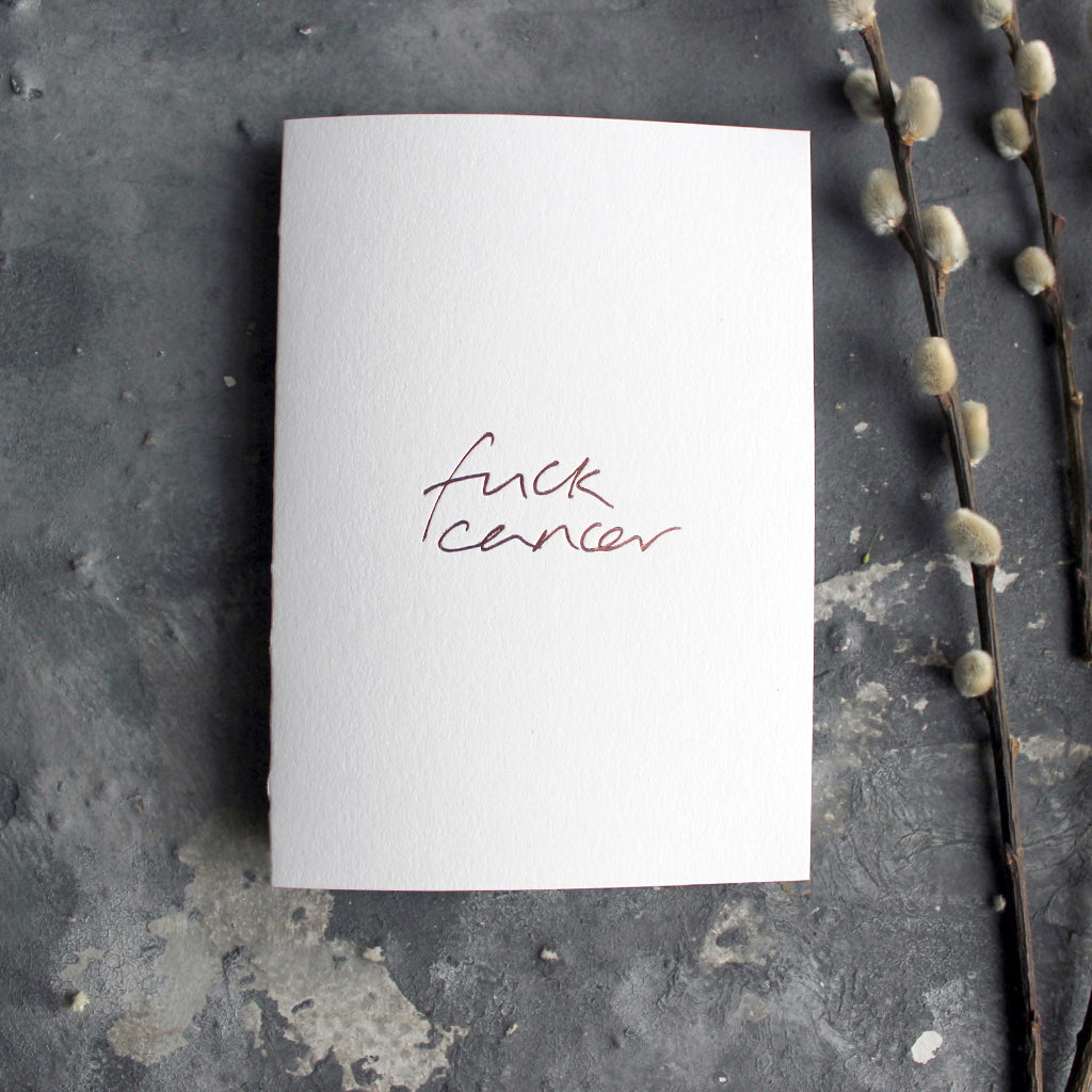 This luxury hand foiled card says 'Fuck Cancer' on the front on white paper