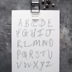 This children's alphabet print is a unique hand drawn typography design in grey letters on white paper.  