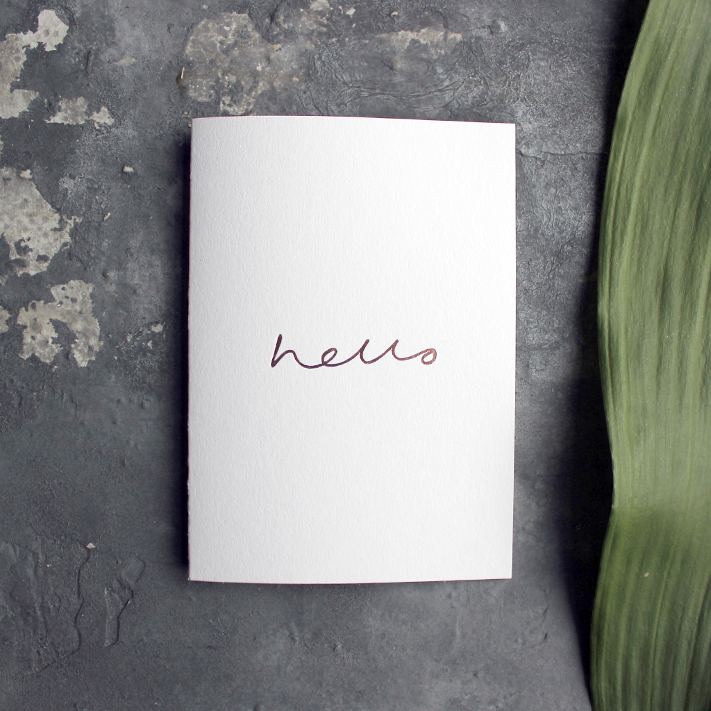 an all round card to send for any occasion that has hello hand written and foil stamped in rose gold