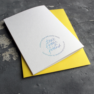 The back of the card has a hand foiled holographic foil logo that says Text From a Friend