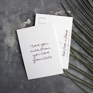 a hand pressed rose gold foil postcard that says I Love You More Than You Love Your Selfie