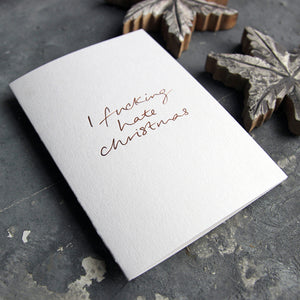 This christmas card says I Fucking Hate Christmas on hand foiled on white luxury paper on grey board