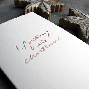 This christmas card says I Fucking Hate Christmas on hand foiled on white luxury paper on grey board