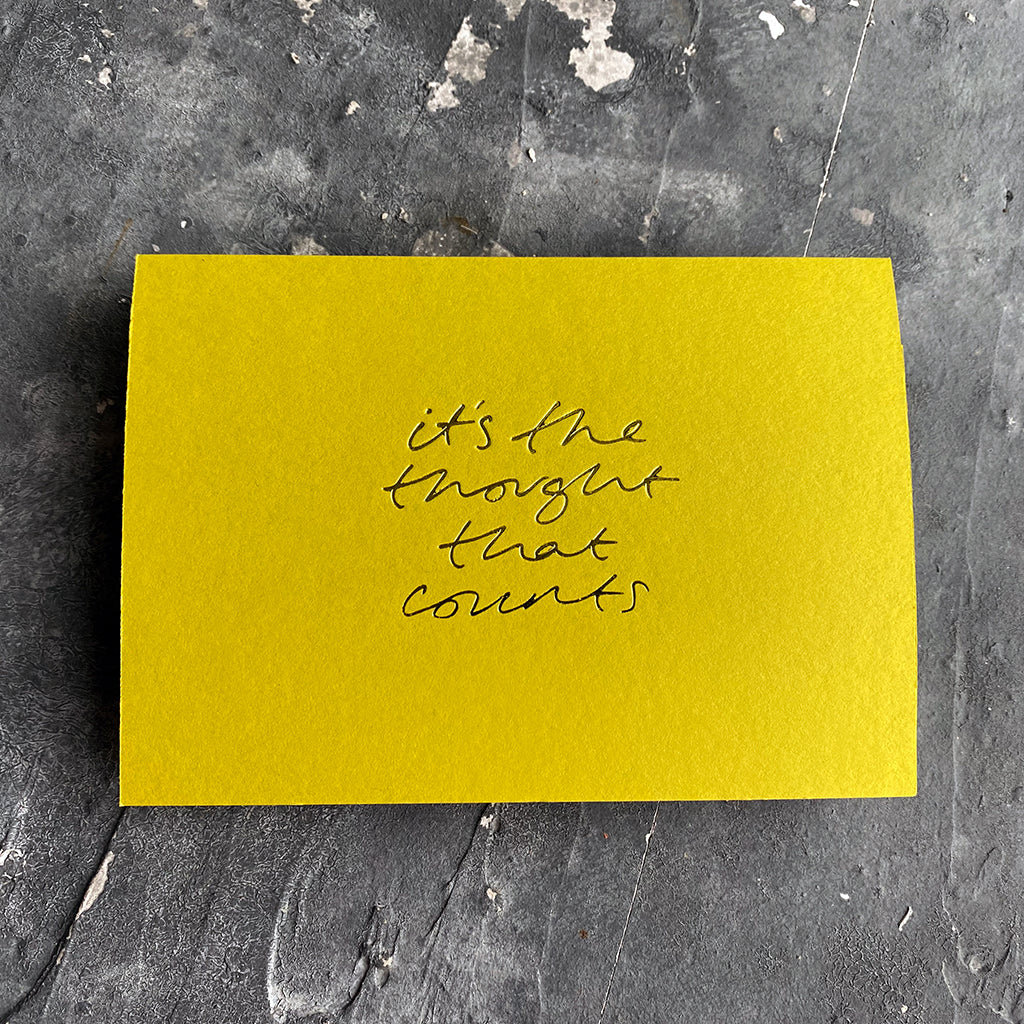 this hand foiled lime coloured cash card says 'It's The Thought That Counts' on the front