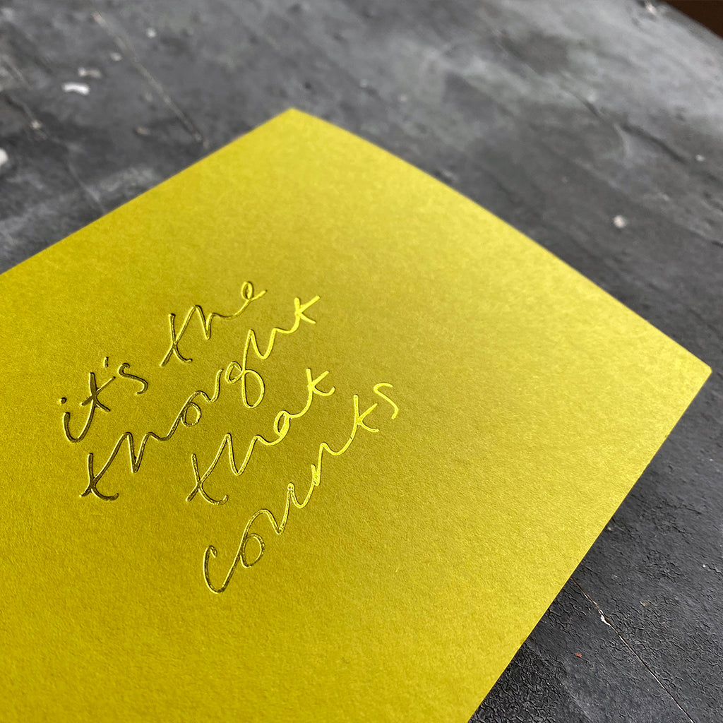 this hand foiled lime coloured cash card says 'It's The Thought That Counts' on the front
