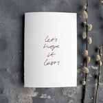 this hand foiled white luxury card say 'let's hope it lasts' on the front
