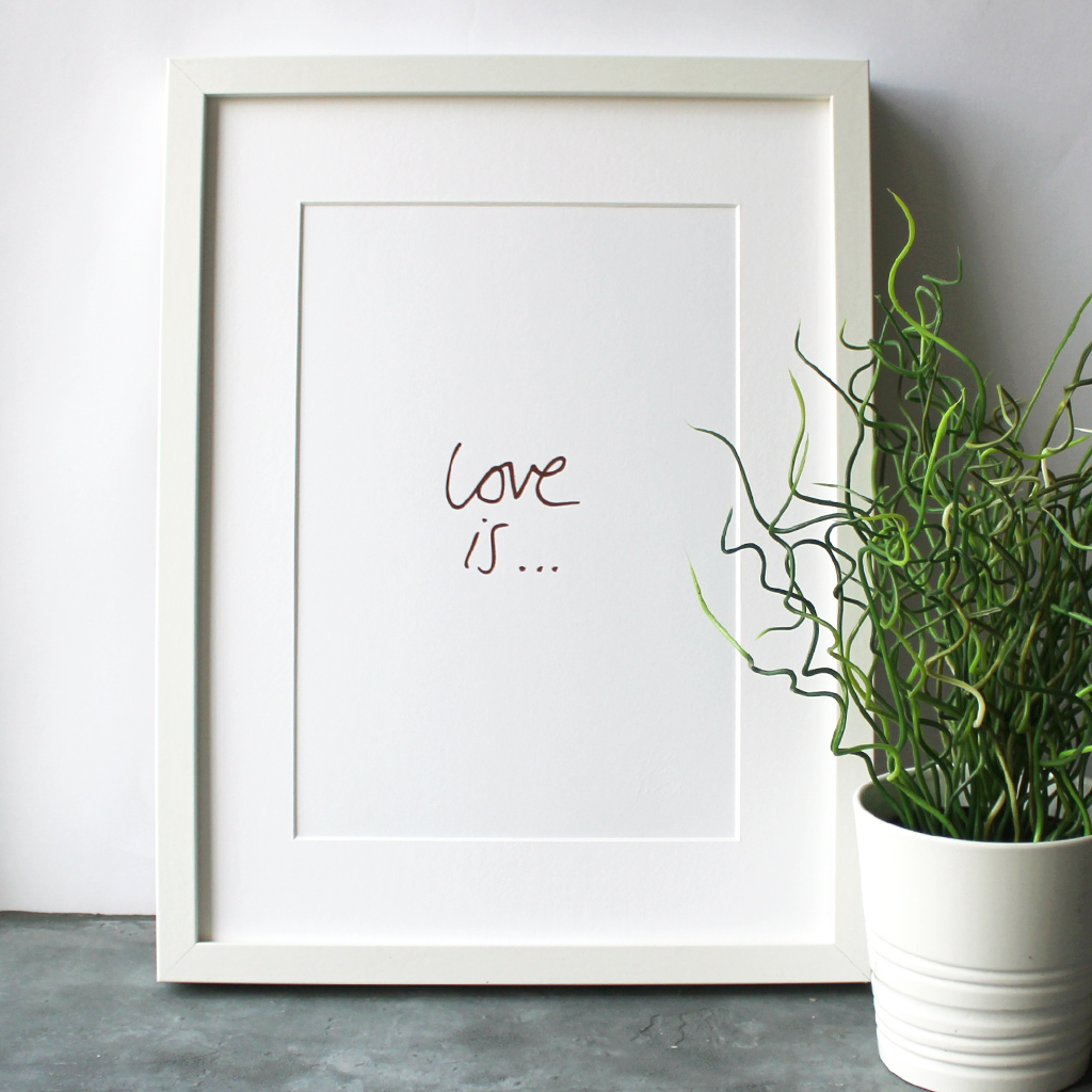 this handwritten Love Is... A4 print is hand pressed in rose gold foil and comes unframed