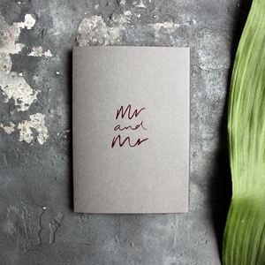 This luxury grey wedding card for the gay couple says Mr and Mr on the front, handwritten and hand foiled in rose gold