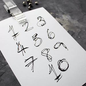 This children's one to ten numbers print is a unique hand drawn typography design in black on white paper. 