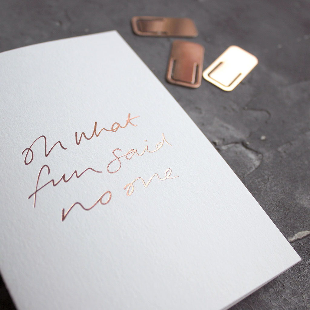This rose gold hand foiled luxury white card says Oh What Fun Said No One on the front in handwriting from Text From A Friend