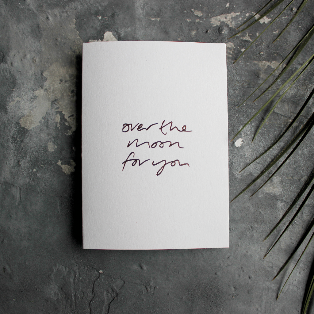 The front of this luxury card says Over The Moon For You and is handwritten and hand foiled in rose gold