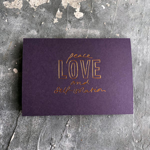 this hand foiled smoke purple coloured cash card says 'Peace Love and Self-Isolation' on the front in rose gold foil