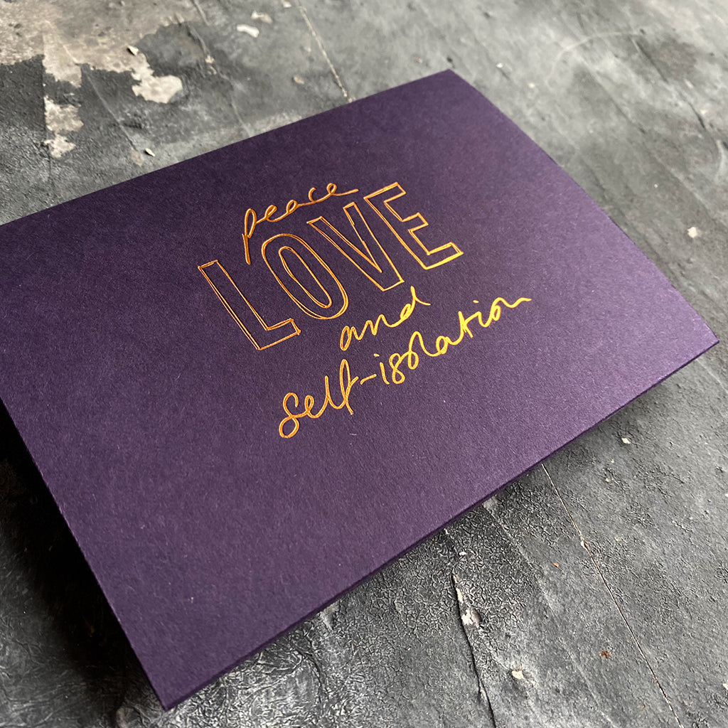 this hand foiled smoke purple coloured cash card says 'Peace Love and Self-Isolation' on the front in rose gold foil