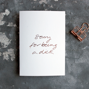 Sorry For Being A Dick white luxury card is hand foiled in rose gold on the front