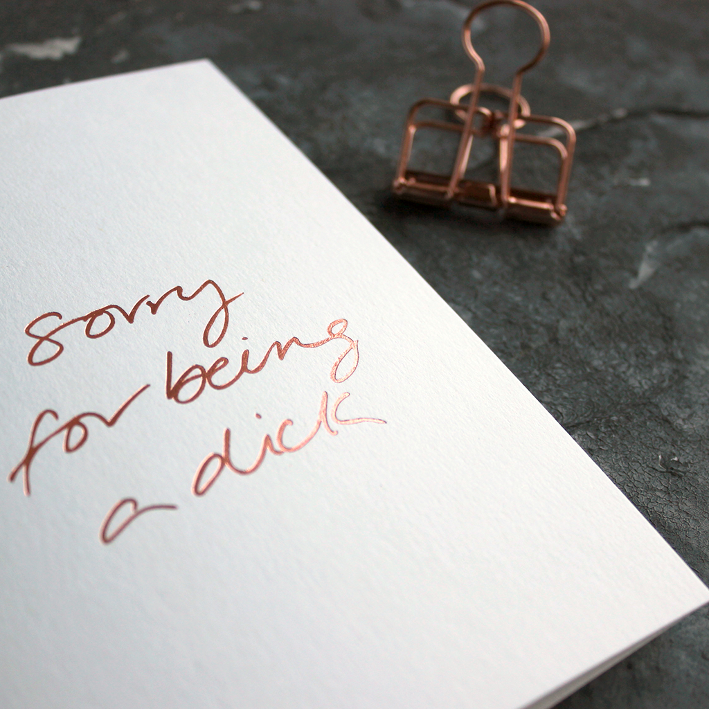 Sorry For Being A Dick white luxury card is hand foiled in rose gold on the front