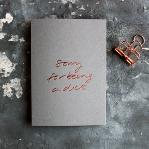 Sorry For Being A Dick grey luxury card is hand foiled in rose gold on the front
