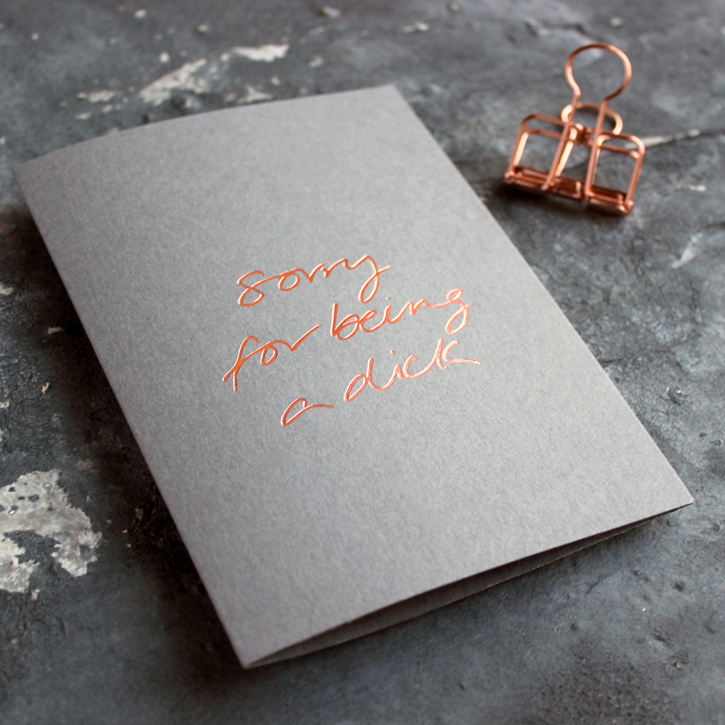 Sorry For Being A Dick grey luxury card is hand foiled in rose gold on the front