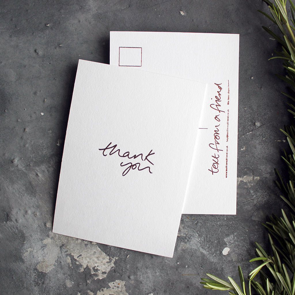 a luxury wedding card that's handwritten with a rose gold foil message saying Thank You