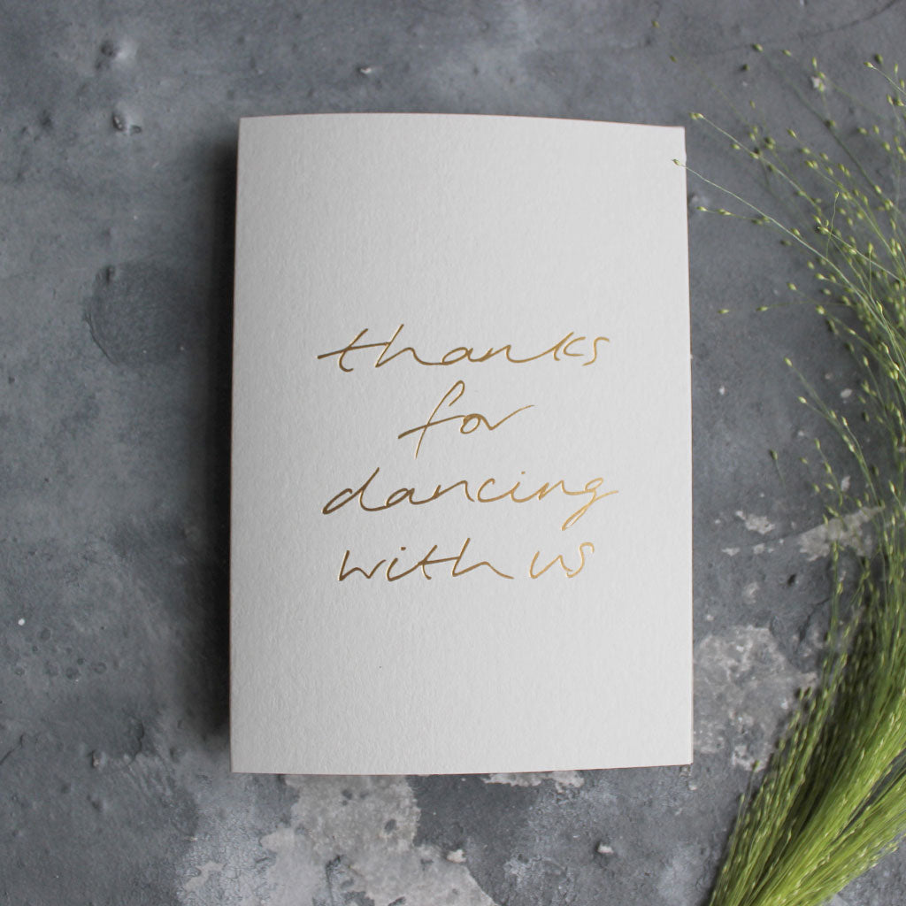 This pale grey luxury card is hand foiled and says 'thanks for dancing with us' on the front