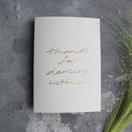 This pale grey luxury card is hand foiled and says 'thanks for dancing with us' on the front