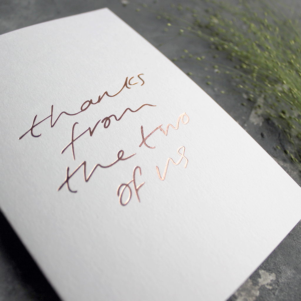 This luxury thank you card is hand foiled on the front and says "thanks from the two of us" on white card