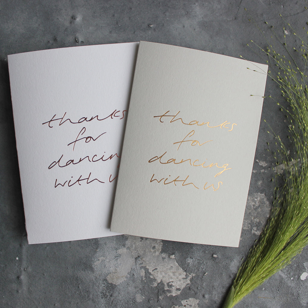 This pale grey or white luxury card is hand foiled and says 'thanks for dancing with us' on the front