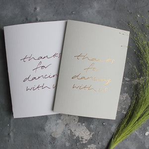 This pale grey or white luxury card is hand foiled and says 'thanks for dancing with us' on the front