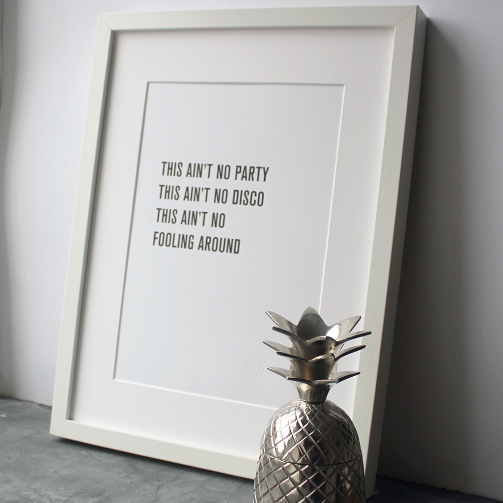 The lyrics "This Ain't No Party This Ain't No Disco" from Talking Heads is a framed print in a typographic design