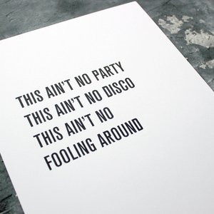 The lyrics "This Ain't No Party This Ain't No Disco" from Talking Heads is a framed print in a typographic design