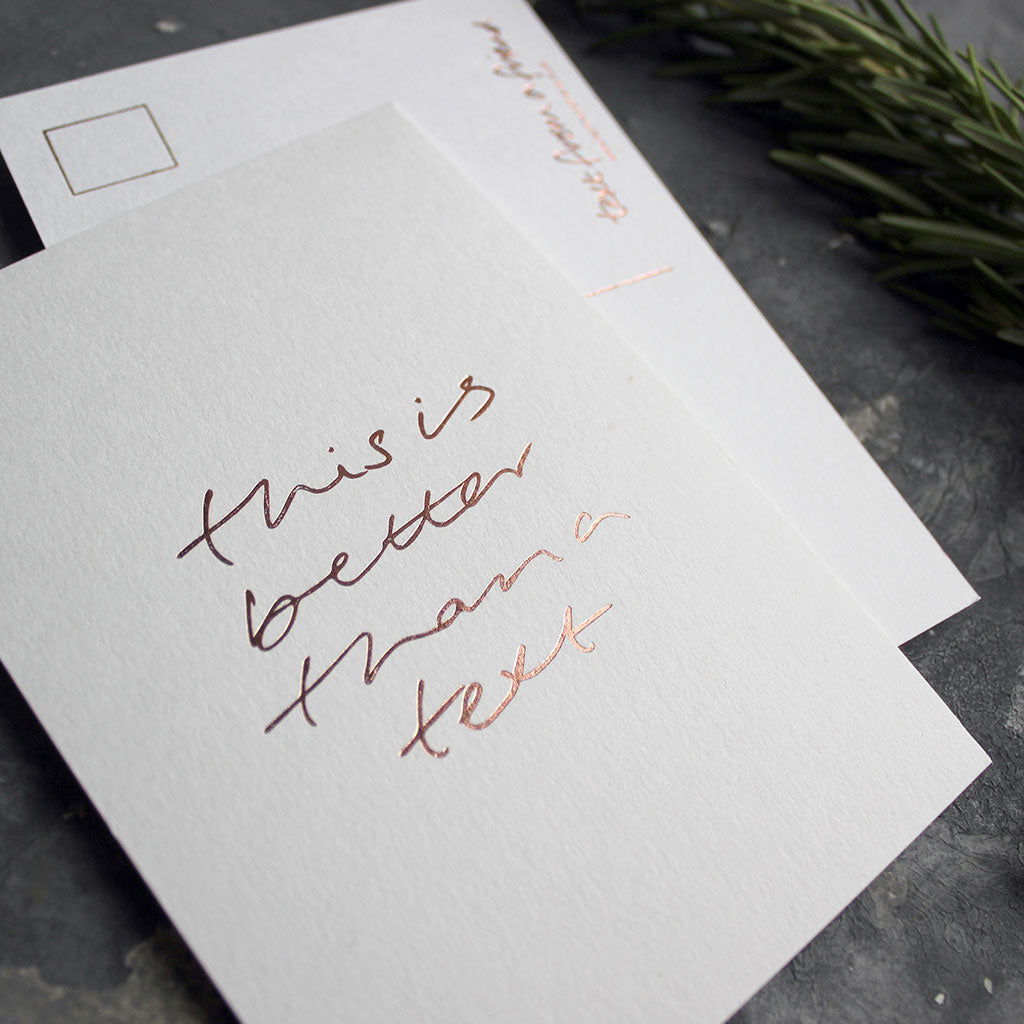 A hand foiled postcard that says This Is Better Than A Text