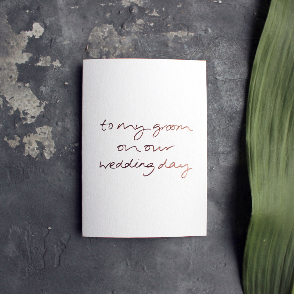 A rose gold hand foiled luxury white card that says To My Groom On Our Wedding Day
