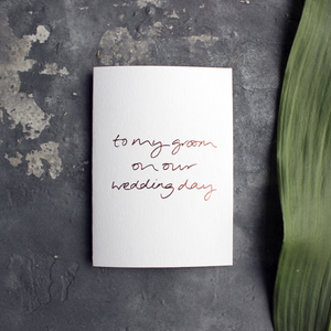 A rose gold hand foiled luxury white card that says To My Groom On Our Wedding Day