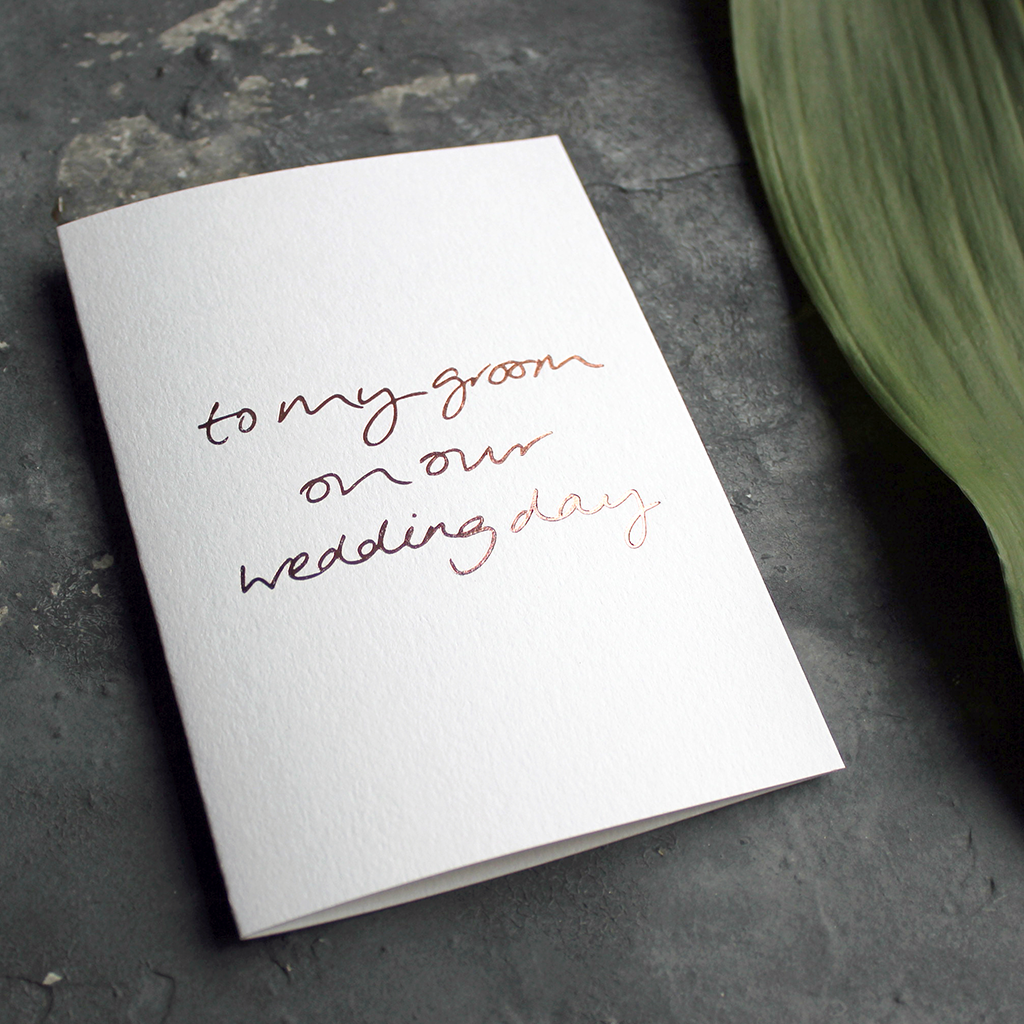 A rose gold hand foiled luxury white card that says To My Groom On Our Wedding Day