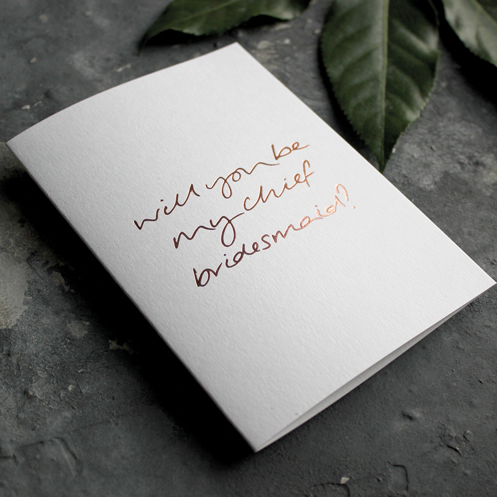 The front of the card says Will You Be My Chief Bridesmaid? hand foiled in Rose Gold