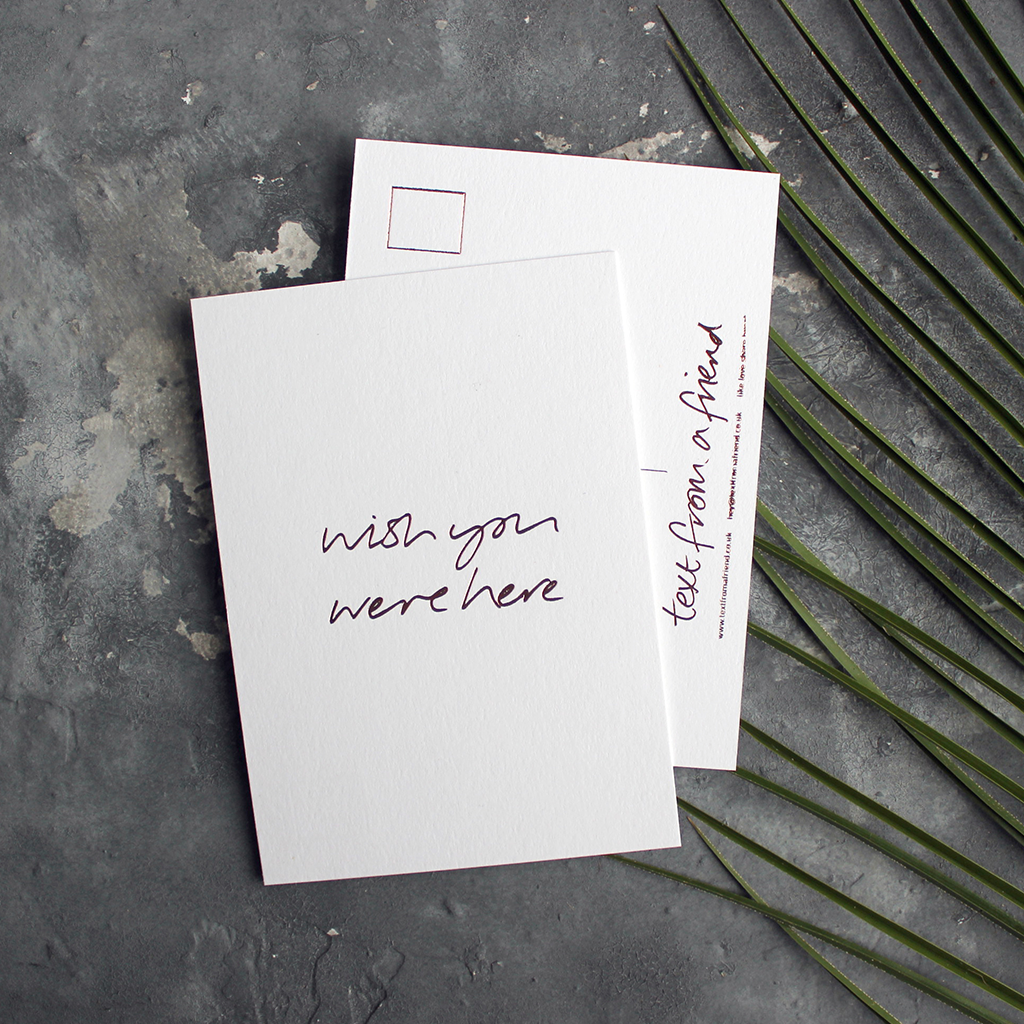 a hand pressed rose gold foil postcard that says Wish You Were Here