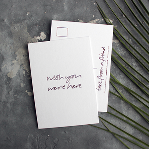 a hand pressed rose gold foil postcard that says Wish You Were Here