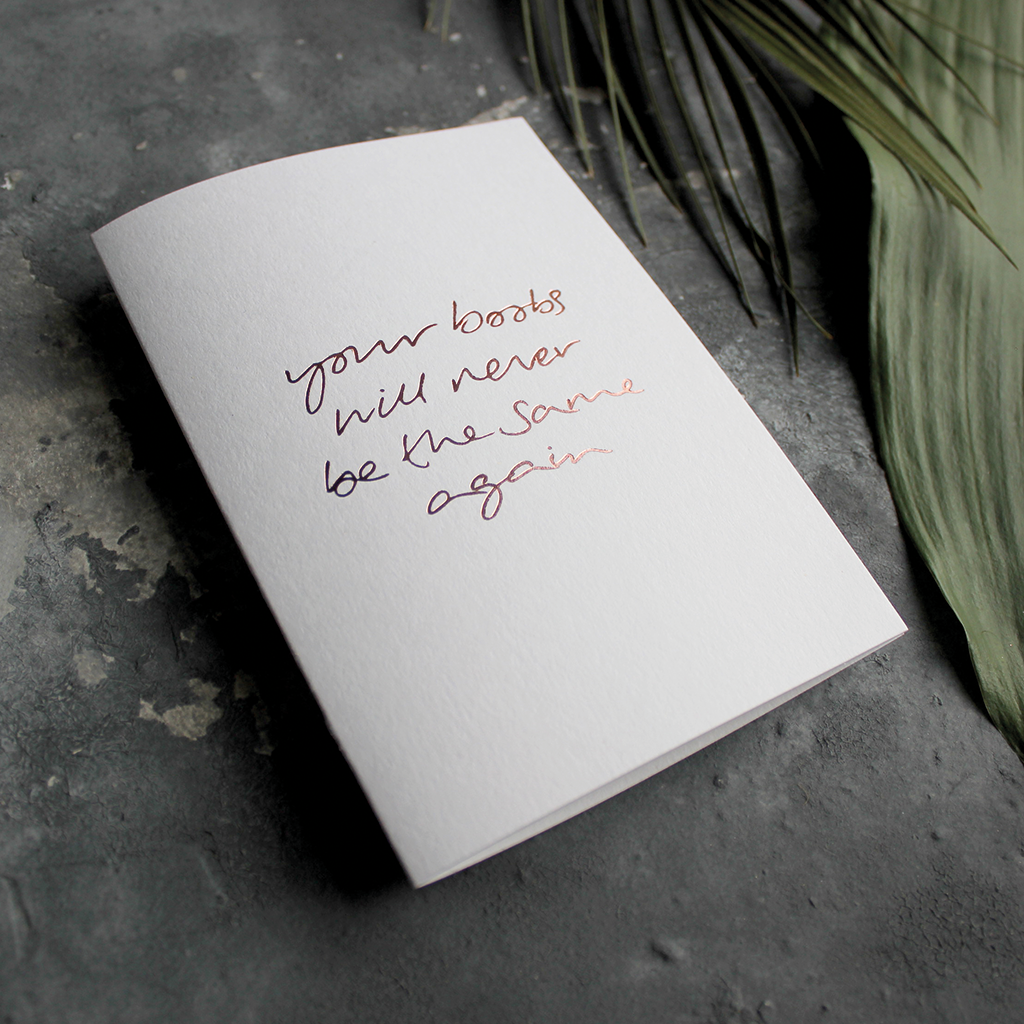 The front of the card says Your Boobs Will Never Be The Same Again hand foiled in Rose Gold