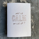 This luxury Christmas Card has a hand written rose gold foil block message saying All Is Calm Or Is It? on the front