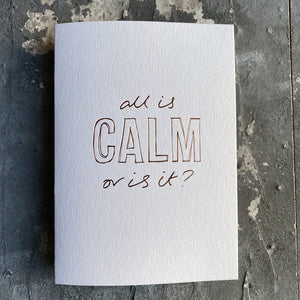 This luxury Christmas Card has a hand written rose gold foil block message saying All Is Calm Or Is It? on the front