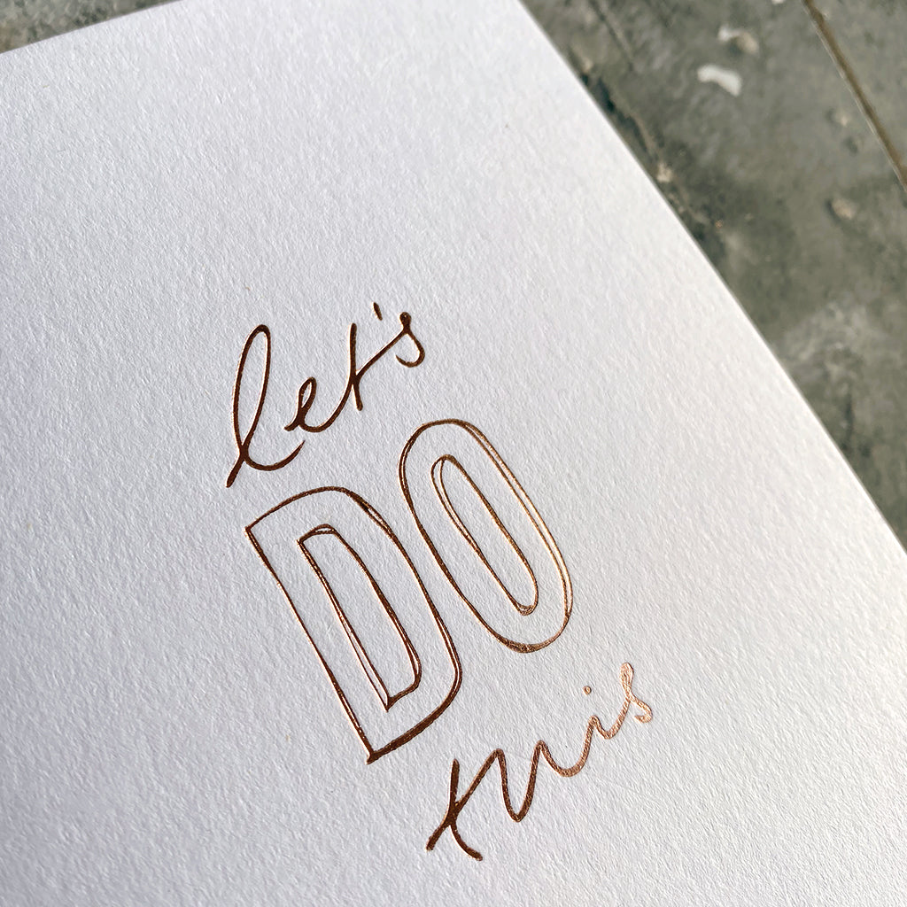 xThis luxThis luxury card has a hand written rose gold foil block message saying Let's Do This on the front